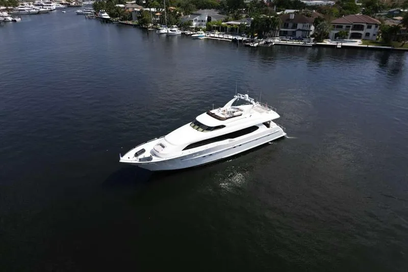 Slide: The Image of Aerial view of a 2001 Lazzara Motoryacht cruising on a calm waterway. - 21