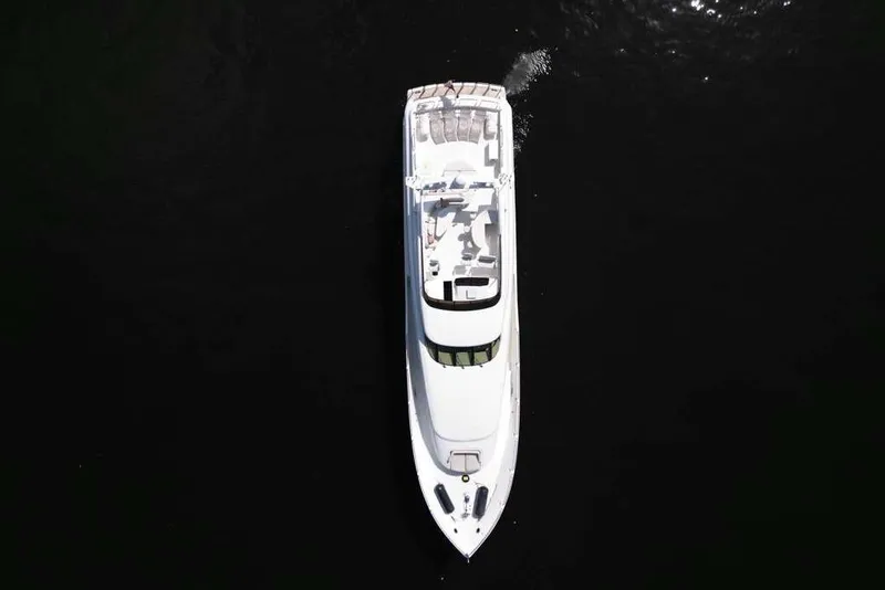 Slide: The Image of Aerial view of a 2001 Lazzara Motoryacht on dark water. - 25