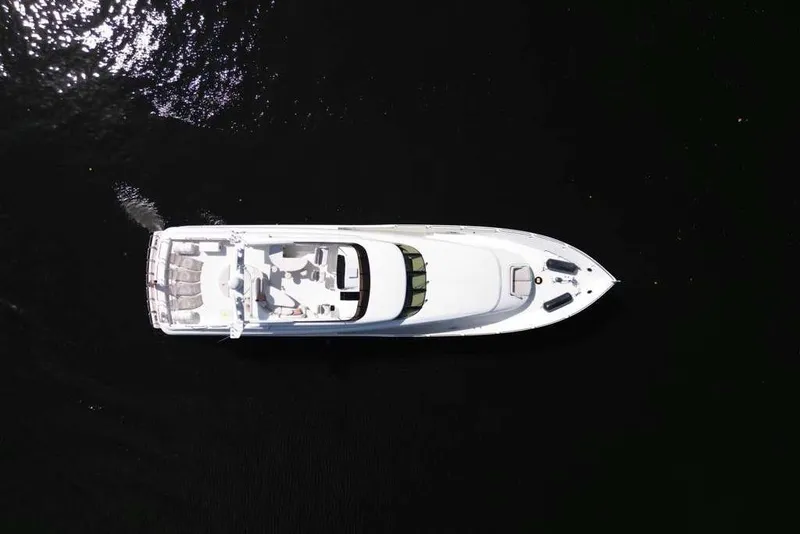 Slide: The Image of Aerial view of 2001 Lazzara Motoryacht cruising on dark water. - 26