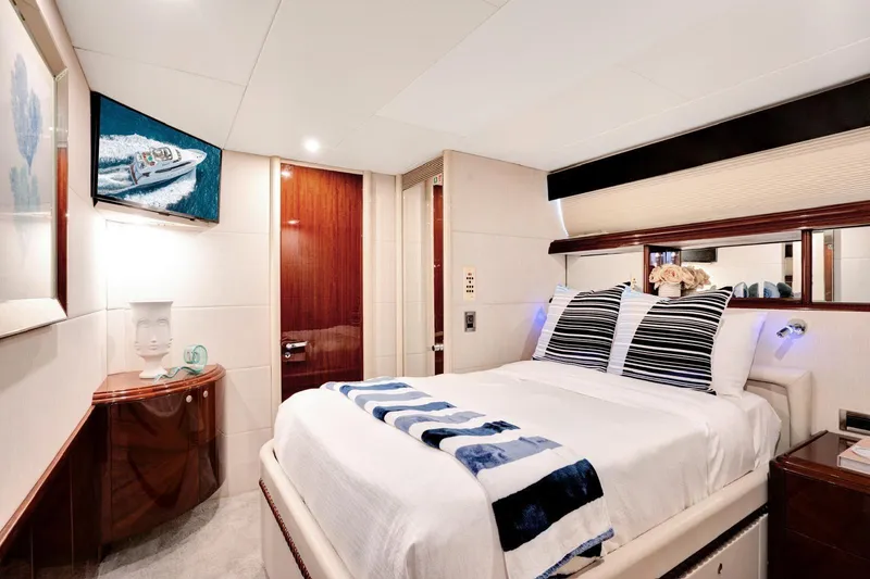 Slide: The Image of Luxurious bedroom interior of a 2001 Lazzara Motoryacht with elegant decor and modern amenities. - 27