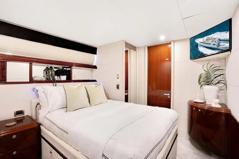 Slide: The Image of Luxurious bedroom interior of a 2001 Lazzara Motoryacht with elegant decor and modern amenities. - 28