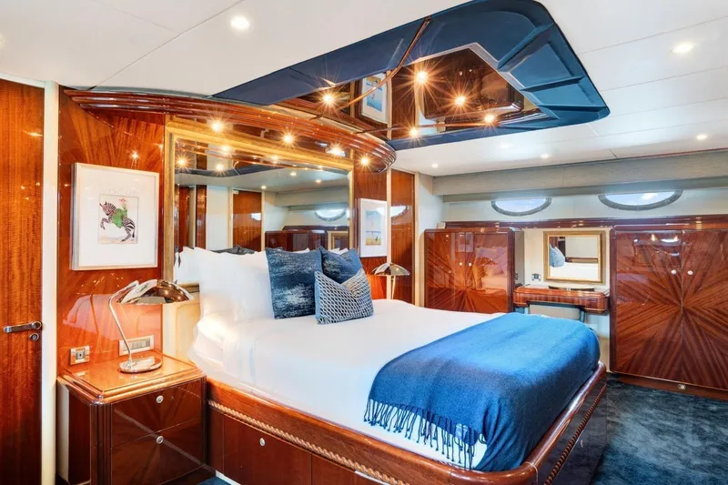 Slide: The Image of Luxurious 2001 Lazzara Motoryacht bedroom with elegant wood finishes and modern decor. - 31