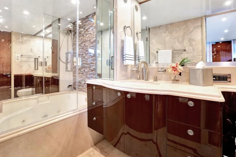 Slide: The Image of Luxurious bathroom in a 2001 Lazzara Motoryacht with elegant fixtures and modern design. - 36