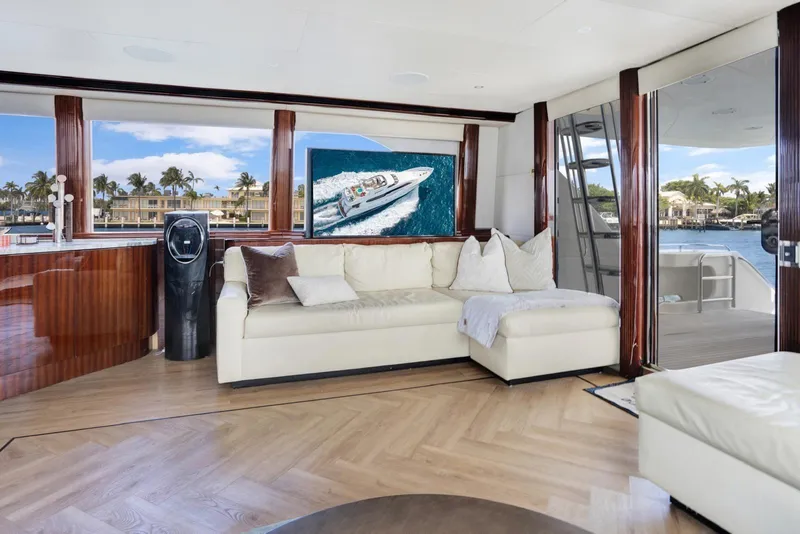 Slide: The Image of Luxurious 2001 Lazzara Motoryacht interior with elegant seating and scenic ocean view. - 37