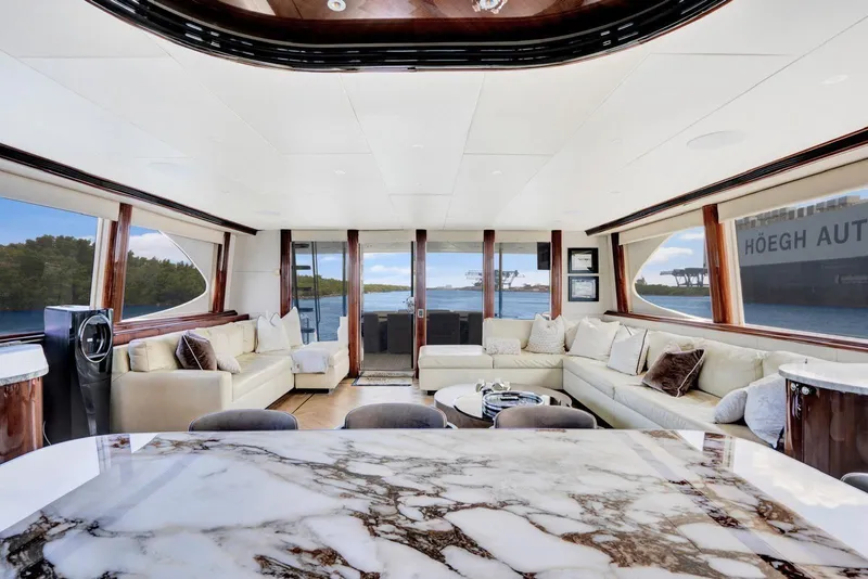 Slide: The Image of Luxurious interior of a 2001 Lazzara Motoryacht with elegant seating and panoramic windows. - 38