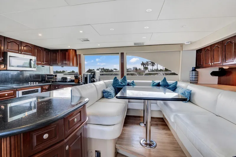 Slide: The Image of Luxurious 2001 Lazzara Motoryacht interior with elegant kitchen and dining area. - 39