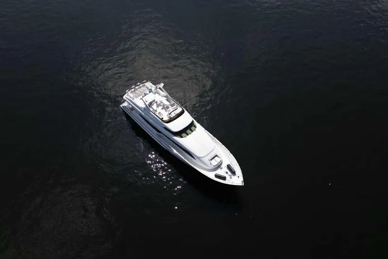 Slide: The Image of Aerial view of 2001 Lazzara Motoryacht on dark water. - 4