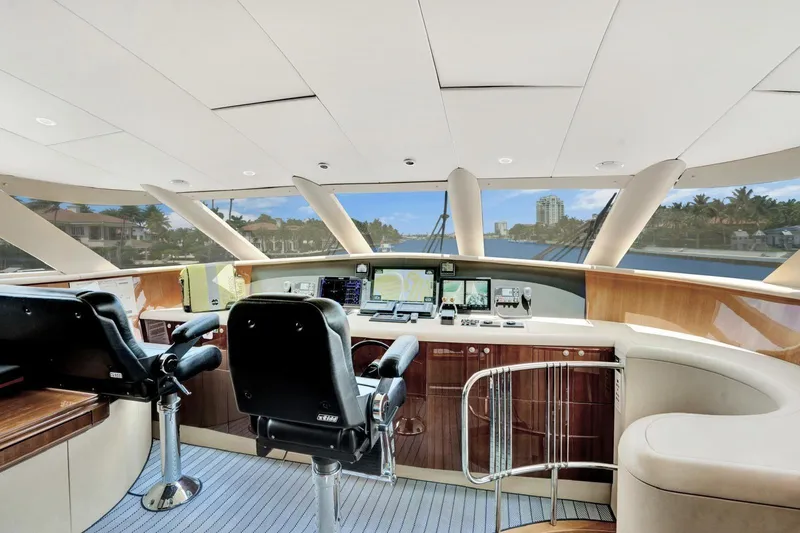 Slide: The Image of Interior view of 2001 Lazzara Motoryacht helm with modern navigation equipment and panoramic windows. - 41