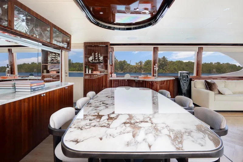 Slide: The Image of Luxurious 2001 Lazzara Motoryacht interior with elegant marble dining table and panoramic windows. - 45