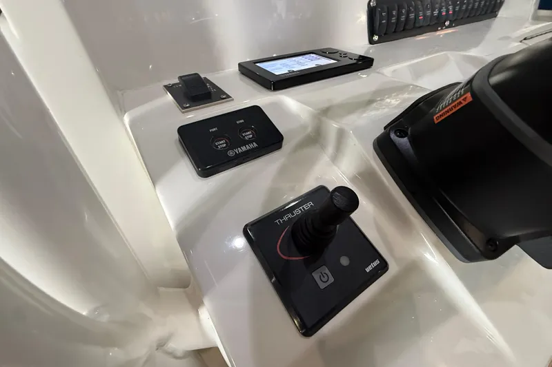Slide: The Image of Control panel of a 2012 Jupiter 34 FS boat featuring Yamaha and Vetus systems. - 10