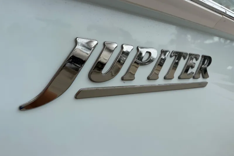 Slide: The Image of Chrome "Jupiter" logo on a 2012 Jupiter 34 FS boat. - 23