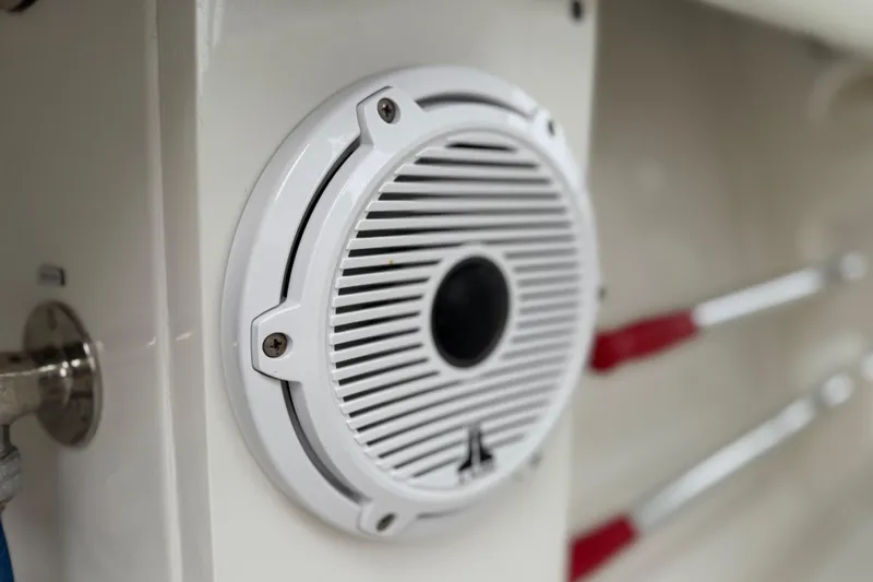 Slide: The Image of Close-up of a white speaker on a 2012 Jupiter 34 FS boat. - 25