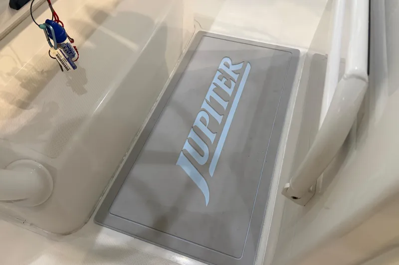 Slide: The Image of Jupiter 34 FS 2012 boat interior with logo on floor mat. - 38