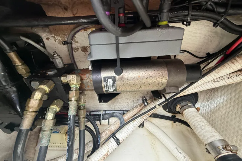 Slide: The Image of Engine compartment of a 2012 Jupiter 34 FS boat, showing hydraulic and electrical components. - 42