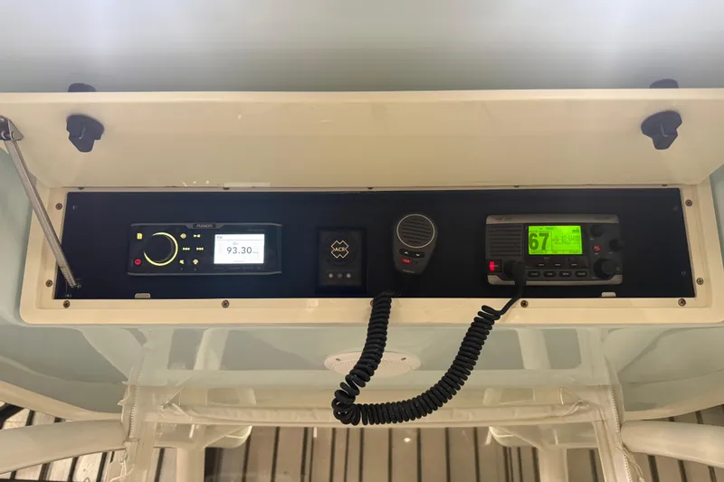 Slide: The Image of Control panel of a 2012 Jupiter 34 FS boat with radio and communication devices. - 6