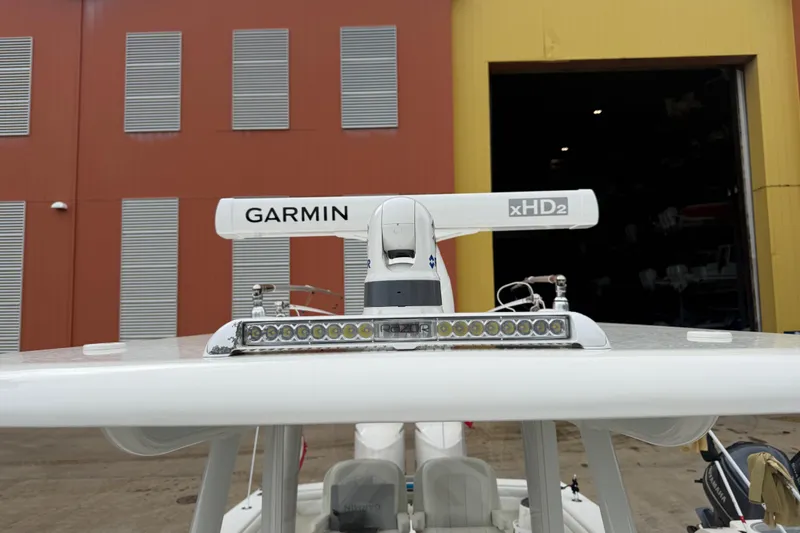 Slide: The Image of Garmin xHD2 radar on 2012 Jupiter 34 FS boat, docked near industrial building. - 7