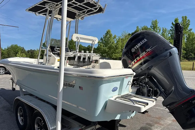 Slide: The Image of 2021 Bulls Bay 2200 boat with Yamaha engine on trailer, parked outdoors. - 14