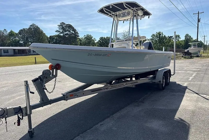 Slide: The Image of 2021 Bulls Bay 2200 boat on trailer in outdoor setting. - 16
