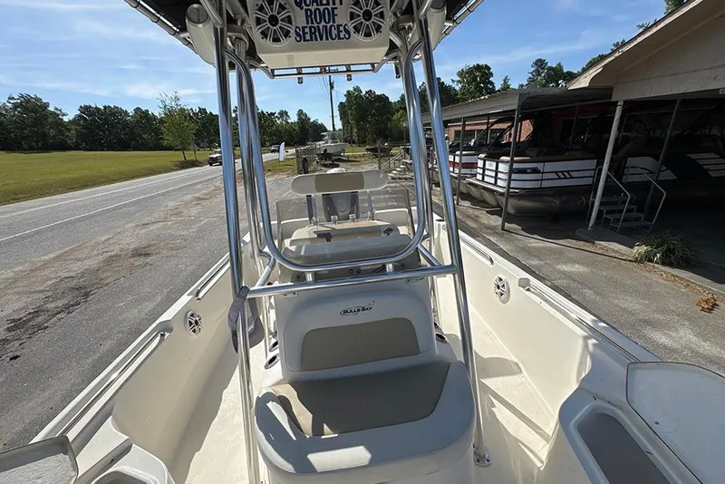 Slide: The Image of 2021 Bulls Bay 2200 boat interior with seating and steering console. - 19