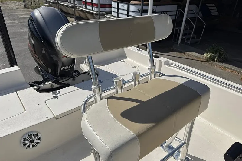 Slide: The Image of 2021 Bulls Bay 2200 boat interior with seating and Yamaha 150 outboard motor. - 21
