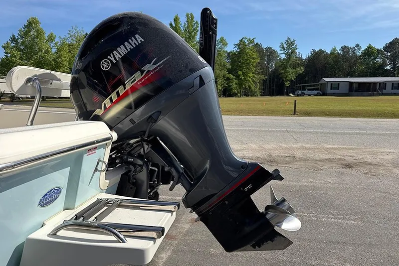 Slide: The Image of 2021 Bulls Bay 2200 boat with Yamaha VMAX outboard motor in a sunny outdoor setting. - 26