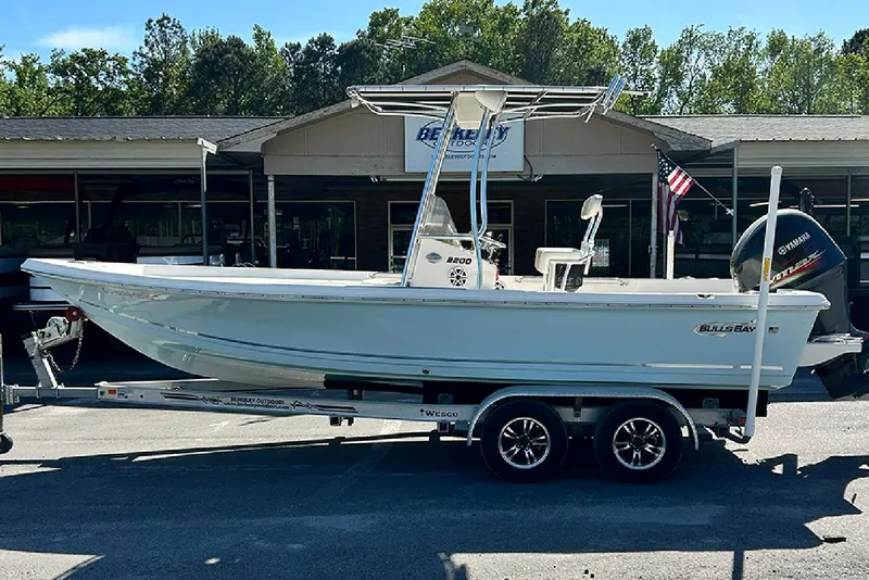 Slide: The Image of 2021 Bulls Bay 2200 boat on trailer outside dealership, side view. - 4