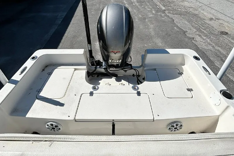 Slide: The Image of 2021 Bulls Bay 2200 boat deck with outboard motor and storage compartments. - 8