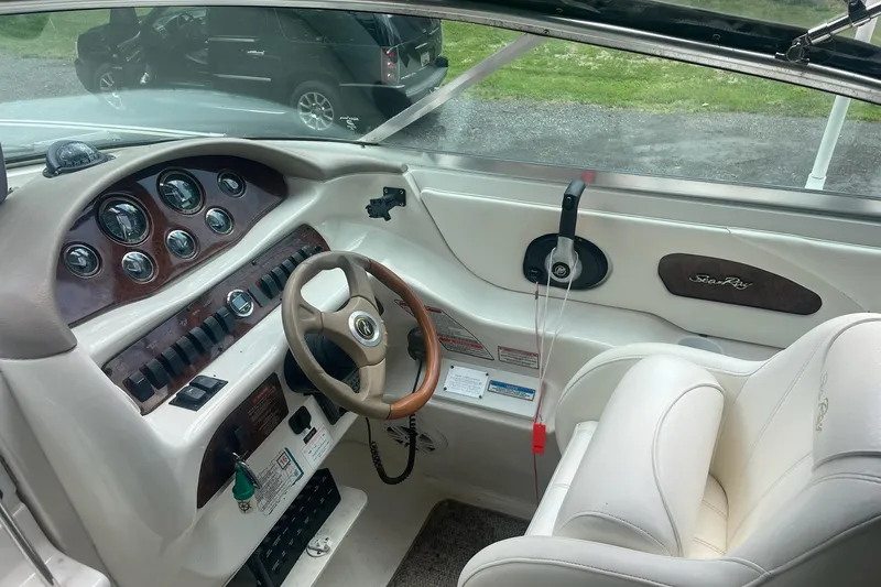 Slide: The Image of Interior view of 2001 Sea Ray 280 Sun Sport boat cockpit with steering wheel and controls. - 12