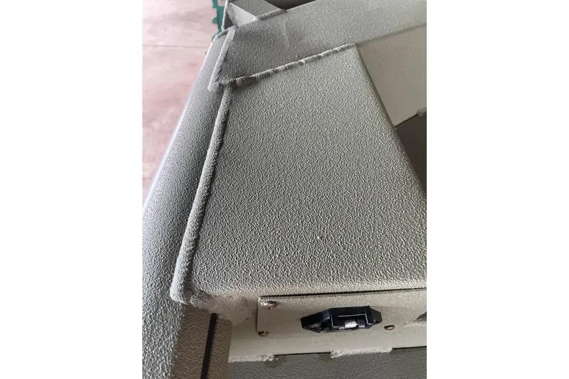 Slide: The Image of Close-up of 2026 Reaper Boats 653 Timber Reaper's textured surface and latch detail. - 11