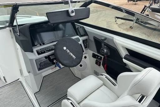 Slide: The Image of 2024 Cobalt R8 boat cockpit with modern steering and controls. - 15