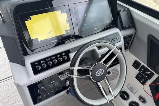 Slide: The Image of 2024 Cobalt R8 boat dashboard with steering wheel and digital displays. - 17