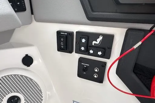 Slide: The Image of 2024 Cobalt R8 boat control panel with seat adjustment and speaker. - 19