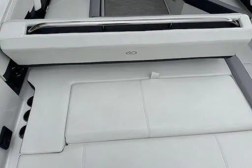 Slide: The Image of 2024 Cobalt R8 boat interior with sleek white seating and modern design. - 25