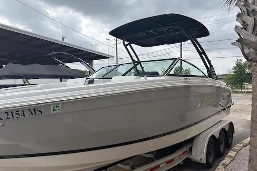 Slide: The Image of 2024 Cobalt R8 boat on trailer, sleek design, overcast sky background. - 3
