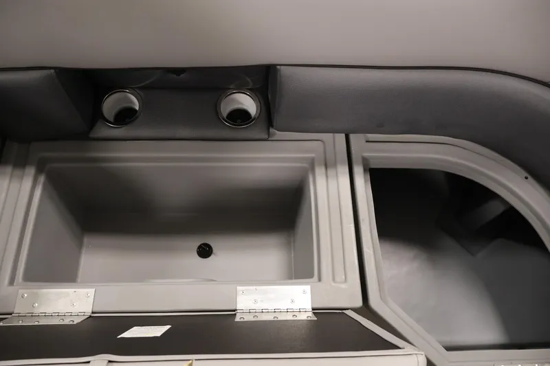 Slide: The Image of Interior storage compartment of 2025 Bentley Pontoons 223 Swingback with cup holders. - 14