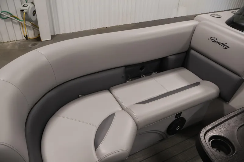 Slide: The Image of 2025 Bentley Pontoons 223 Swingback interior seating with elegant gray upholstery. - 15