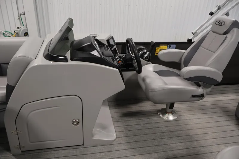Slide: The Image of 2025 Bentley Pontoons 223 Swingback helm with modern steering and comfortable captain's chair. - 18