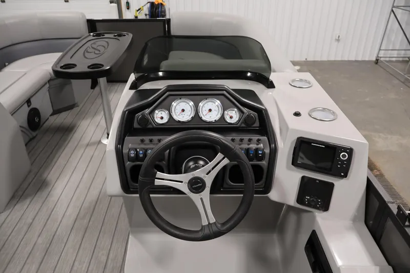 Slide: The Image of 2025 Bentley Pontoons 223 Swingback dashboard with steering wheel and control panel. - 20