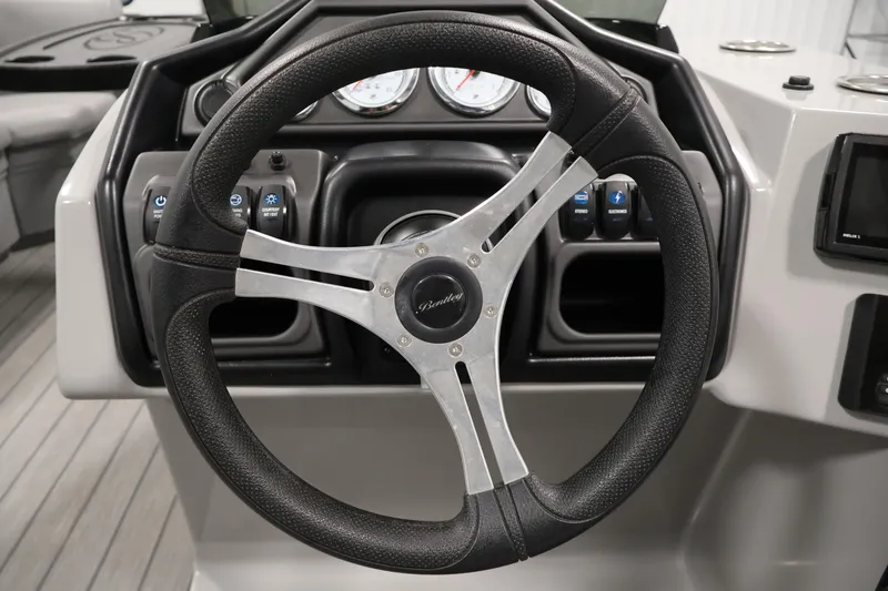 Slide: The Image of Steering wheel of 2025 Bentley Pontoons 223 Swingback with dashboard controls. - 21