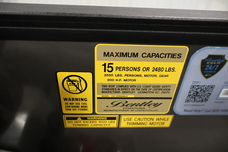 Slide: The Image of 2025 Bentley Pontoons 223 Swingback capacity label, 15 persons or 2480 lbs, safety warnings. - 28