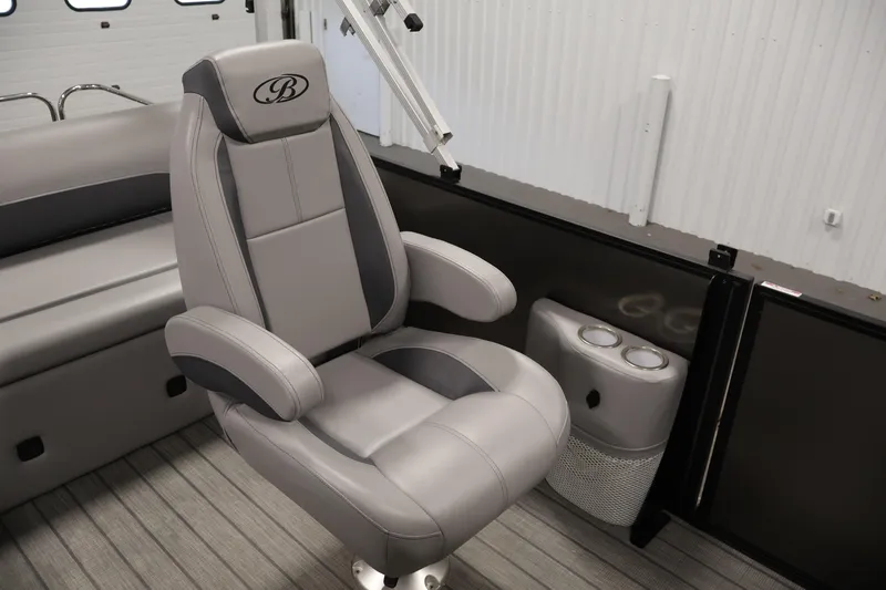 Slide: The Image of 2025 Bentley Pontoons 223 Swingback captain's chair with sleek gray upholstery. - 30