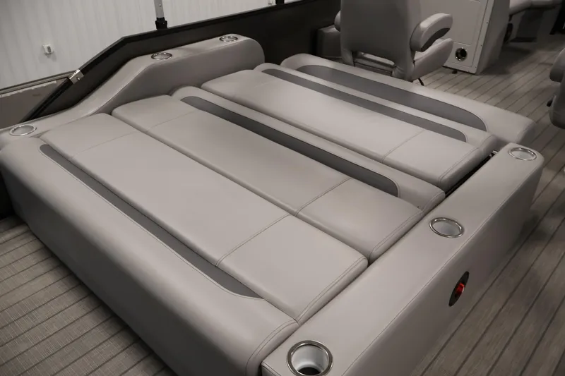 Slide: The Image of Luxurious seating on 2025 Bentley Pontoons 223 Swingback with sleek design and cup holders. - 33