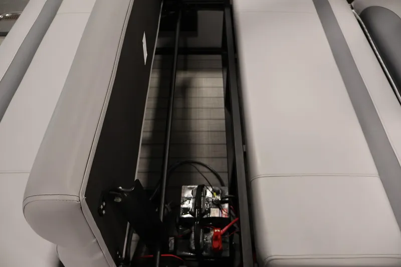 Slide: The Image of 2025 Bentley Pontoons 223 Swingback interior storage compartment with battery and wiring. - 34
