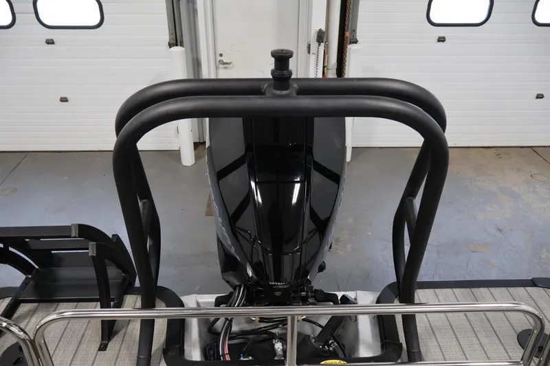 Slide: The Image of 2025 Bentley Pontoons 223 Swingback motor in a garage setting. - 35