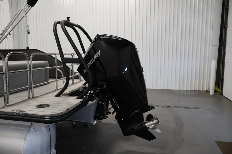 Slide: The Image of 2025 Bentley Pontoons 223 Swingback with Mercury outboard motor in a showroom. - 37