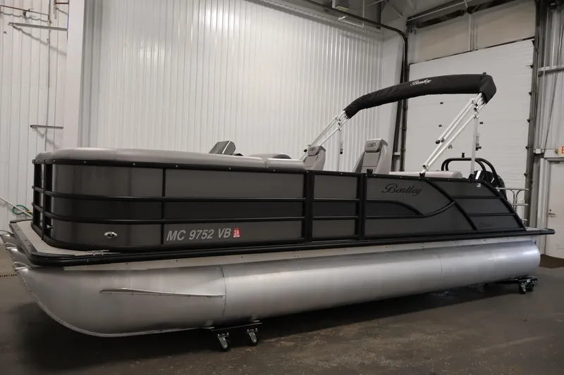 Slide: The Image of 2025 Bentley Pontoons 223 Swingback pontoon boat in a warehouse setting. - 8