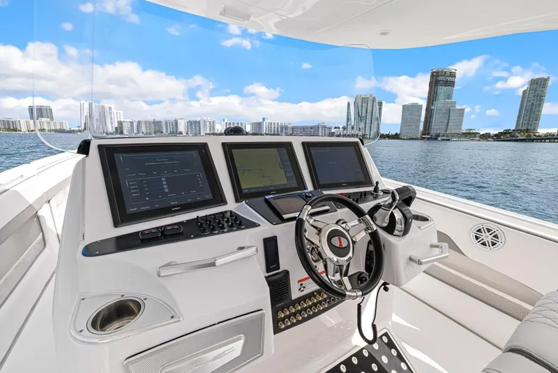 Slide: The Image of Interior view of 2015 Cigarette 41' GTR boat with modern helm console. - 10