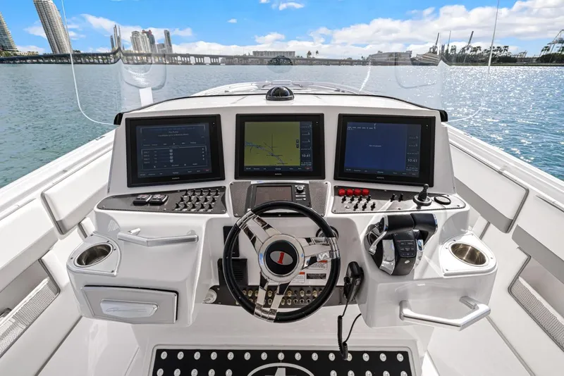 Slide: The Image of Cockpit of a 2015 Cigarette 41' GTR boat with modern electronics. - 11