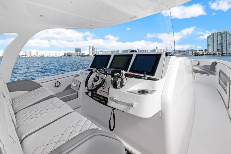 Slide: The Image of Luxurious cockpit of Cigarette 41' GTR yacht, 2015 model, on open water. - 12