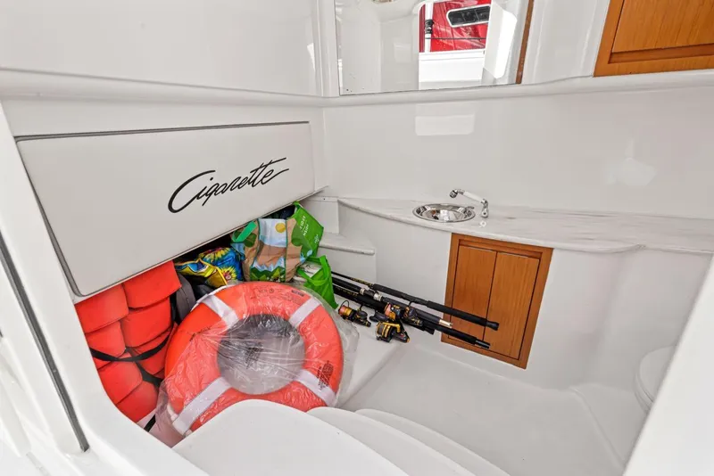 Slide: The Image of Interior of Cigarette 41' GTR boat with fishing gear and life vests. - 25
